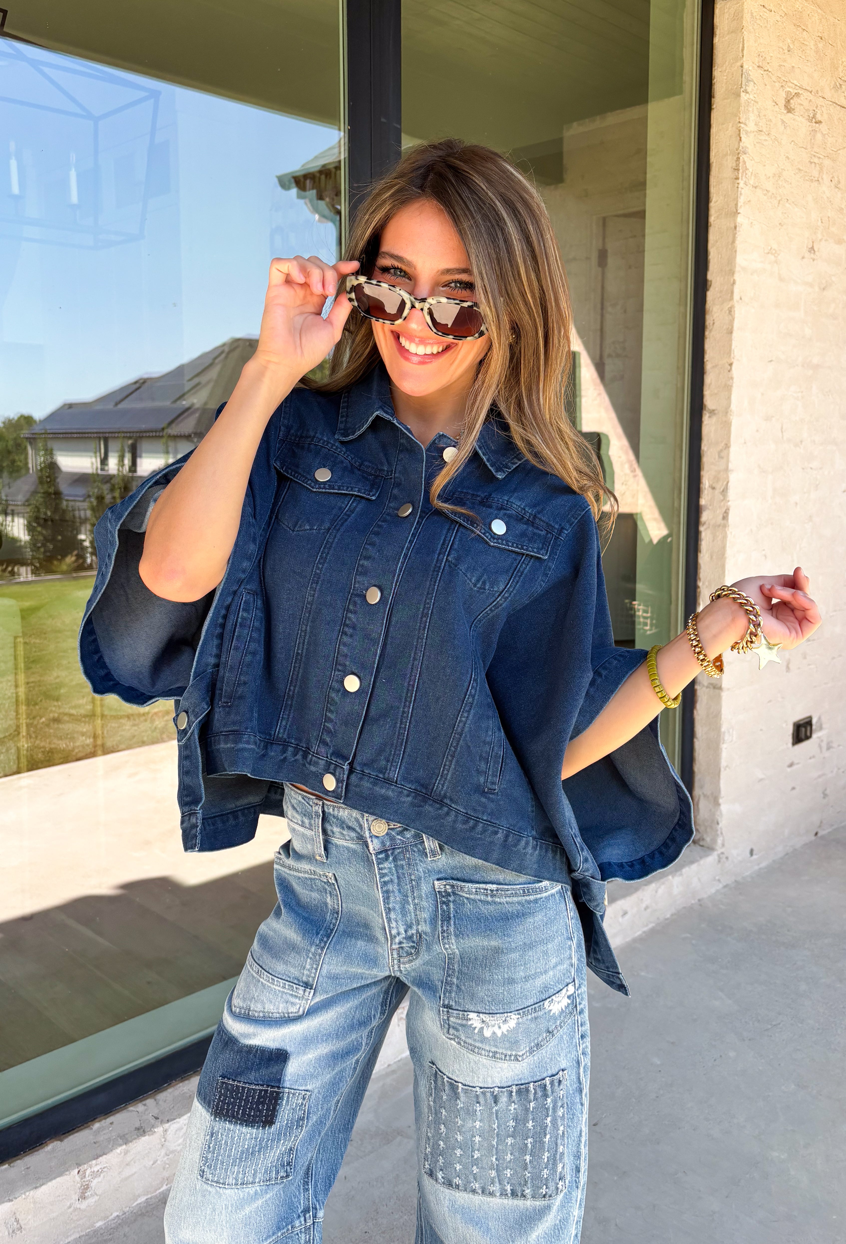 Give your everyday layers a fresh update with this dark wash denim jacket from Entro. The rich denim wash brings a classic feel to the relaxed, draped silhouette, making it an easy piece to throw on when your outfit needs a little something extra. Snap buttons down the front keep the look casual, while chest pockets and additional front pockets add functional detail. Snap button closures at the sides give the design an unexpected finishing touch while complementing its easygoing shape. 