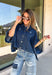 Give your everyday layers a fresh update with this dark wash denim jacket from Entro. The rich denim wash brings a classic feel to the relaxed, draped silhouette, making it an easy piece to throw on when your outfit needs a little something extra. Snap buttons down the front keep the look casual, while chest pockets and additional front pockets add functional detail. Snap button closures at the sides give the design an unexpected finishing touch while complementing its easygoing shape. 