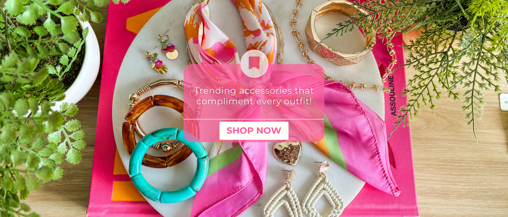 Trending accessories that compliment every outfit! Shop now!

multiple colorful jewelry pieces layered in the back on a marble tile 
