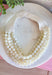 Add a soft, timeless touch to your look with this eye-catching ivory layered beaded necklace. Featuring seven strands of ivory beads, this chunky statement piece creates a full, dimensional look that makes even the simplest outfit feel a little more fun. The faux leather backing helps keep each layer beautifully arranged, while the magnetic closure makes it easy to put on and take off. It’s the perfect finishing touch for sweaters, dresses, blouses, and everyday basics.