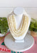 Add a soft, timeless touch to your look with this eye-catching ivory layered beaded necklace. Featuring seven strands of ivory beads, this chunky statement piece creates a full, dimensional look that makes even the simplest outfit feel a little more fun. The faux leather backing helps keep each layer beautifully arranged, while the magnetic closure makes it easy to put on and take off. It’s the perfect finishing touch for sweaters, dresses, blouses, and everyday basics.