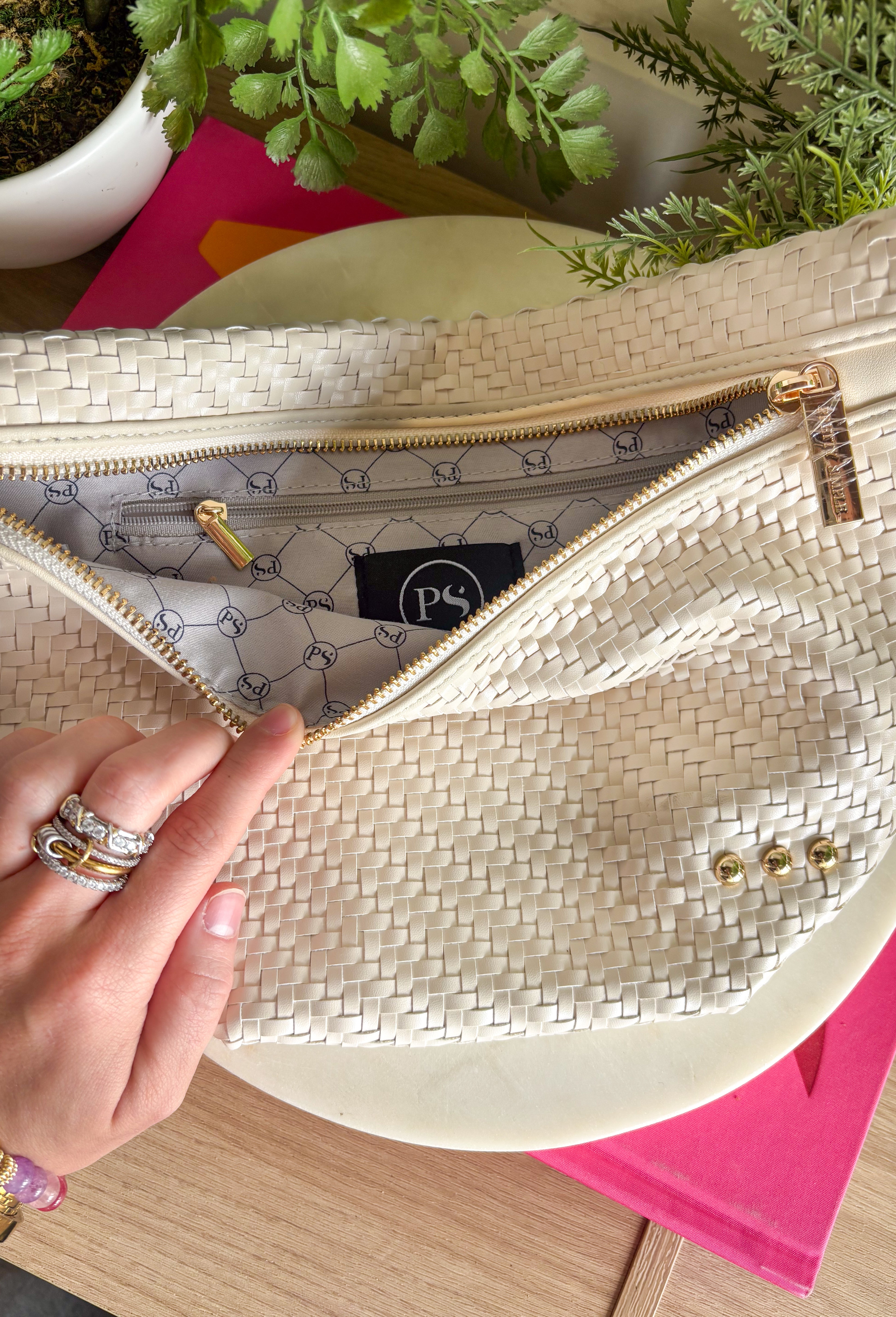 Meet your favorite Westlyn Woven Bum Bag in a new style! Gorgeous diagonal woven design makes this perfect for any occasion! Beautiful hardware with a zipper closure with "Pretty Simple" interior, and a zippered slash pocket on the inside. This crossbody bag is the perfect accessory to elevate any outfit!