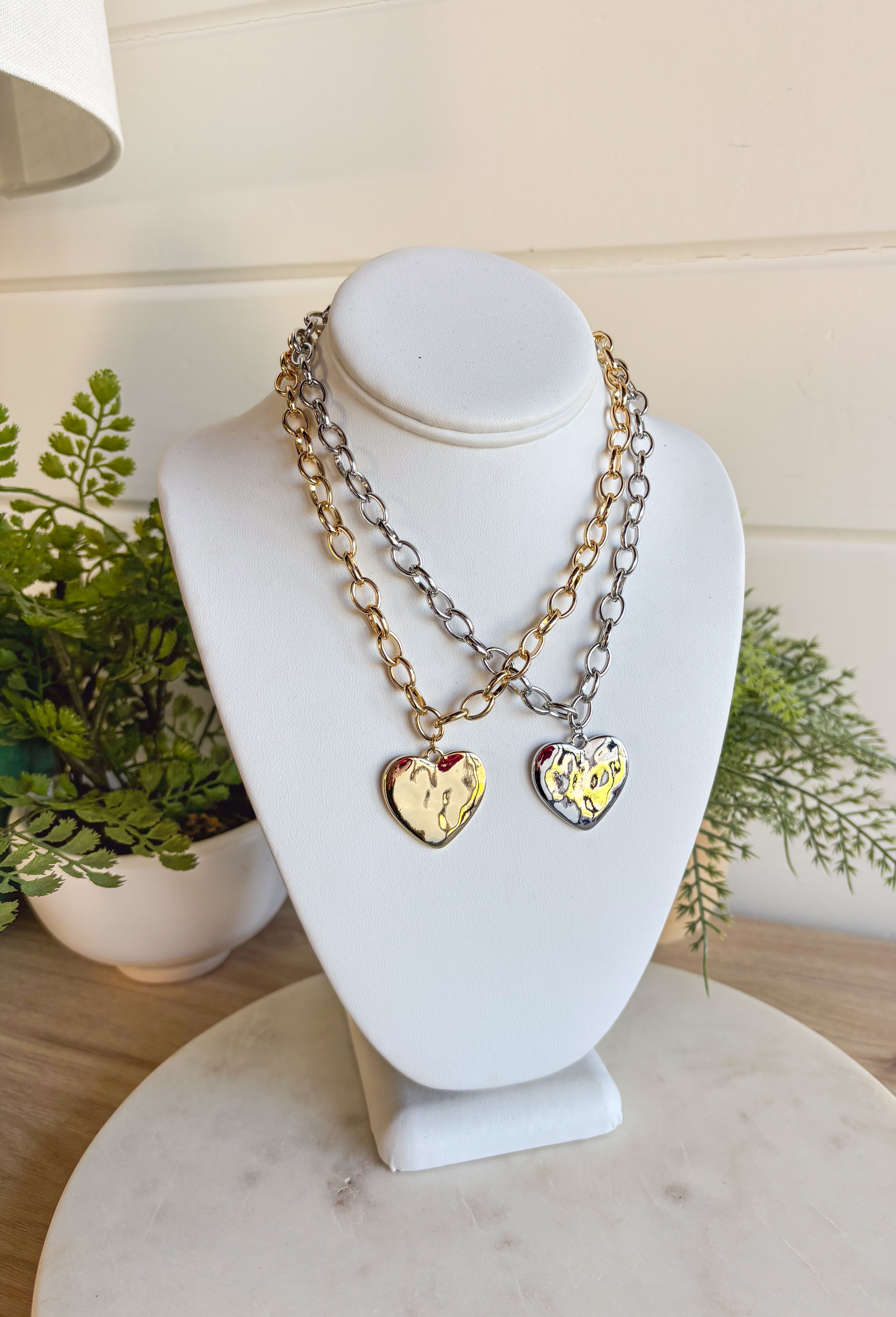 Simple, stylish, and oh-so versatile—this gold chain necklace is the perfect finishing touch for any look. Designed with a textured heart charm, it adds just the right amount of detail and personality without overpowering your outfit. With its adjustable extender, you can wear it closer to the neckline for layering or a little longer on its own. A timeless piece you’ll keep reaching for, no matter the occasion.