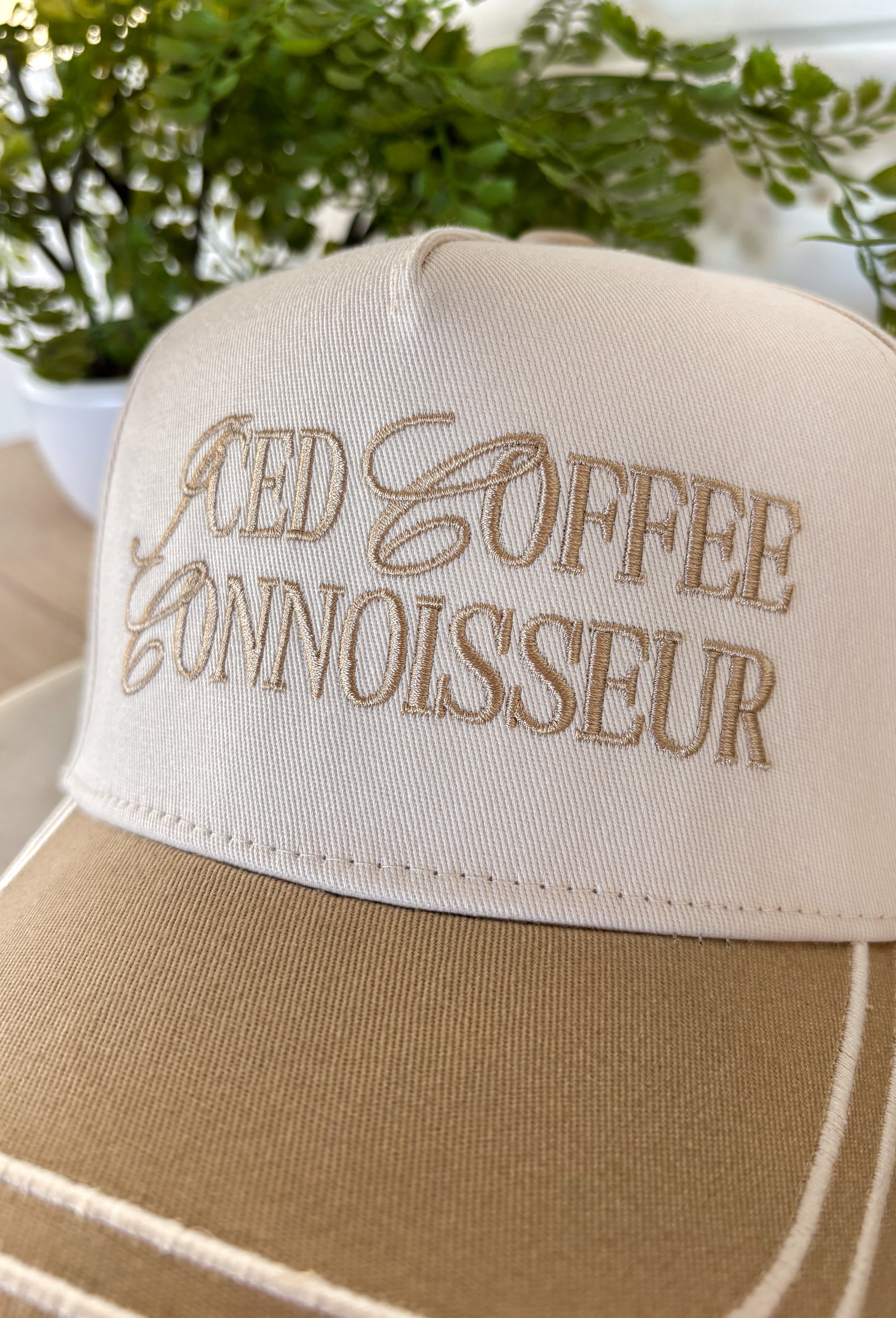 This neutral trucker hat with tan accents is a must-have for all the iced coffee lovers out there. Featuring “Iced Coffee Connoisseur” embroidered across the front, it adds a fun, laid-back touch to your everyday outfits. The neutral color palette keeps it easy to style, while the adjustable back offers a comfortable, custom fit for all-day wear. Perfect for coffee runs, casual days, and sunny spring outings, this hat is equal parts playful and practical.