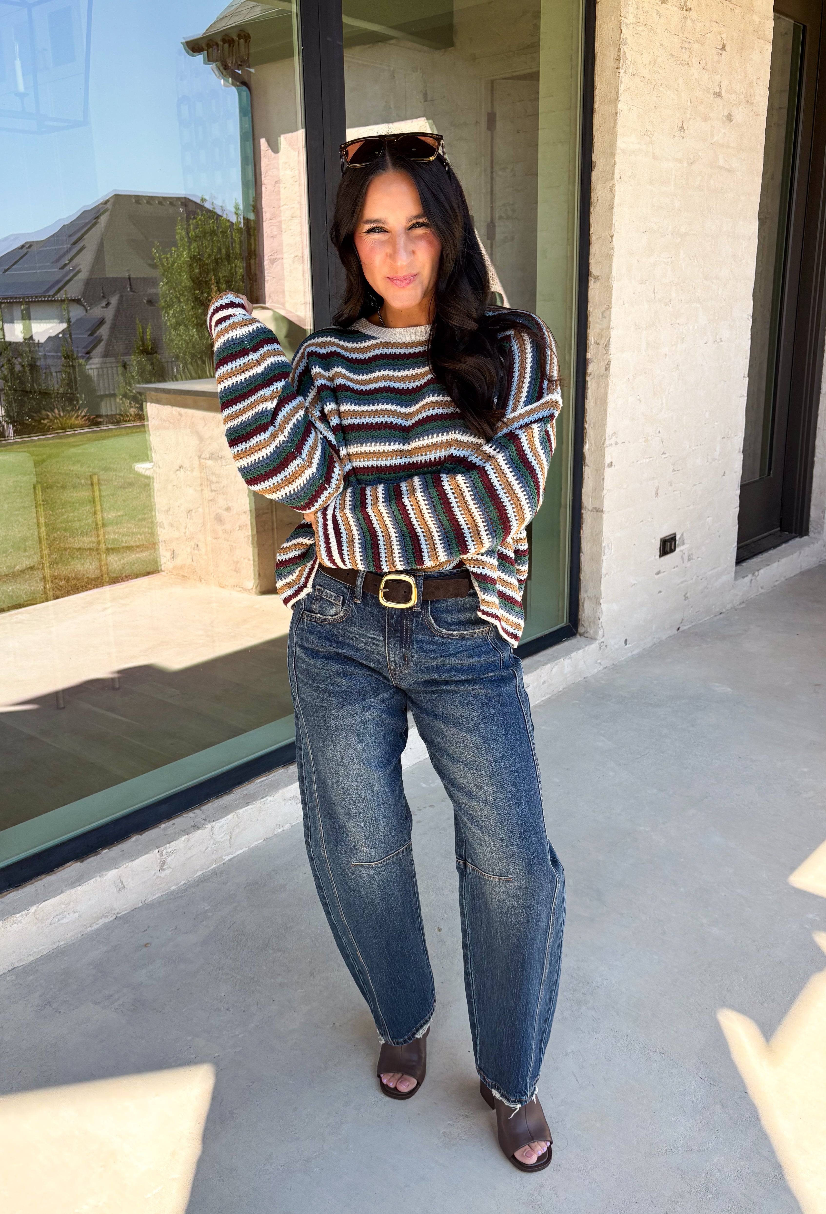 Wrap yourself in the colors of the season with this cozy open knit sweater from Hyfve. Featuring a beautiful stripe pattern in cream, tan, light blue, burgundy, hunter green, and dark blue, this timeless knit captures everything you love about fall. The lightweight open knit construction makes it perfect for layering on crisp mornings and cool evenings, while the relaxed silhouette keeps it effortlessly comfortable. 