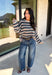 Wrap yourself in the colors of the season with this cozy open knit sweater from Hyfve. Featuring a beautiful stripe pattern in cream, tan, light blue, burgundy, hunter green, and dark blue, this timeless knit captures everything you love about fall. The lightweight open knit construction makes it perfect for layering on crisp mornings and cool evenings, while the relaxed silhouette keeps it effortlessly comfortable. 