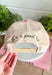 Add a playful outdoor-inspired touch to your everyday look with this unique trucker hat. Featuring a neutral faux suede front and a camouflage bill, this standout style is embroidered with a detailed mallard design accented by pink and orange stitching for an unexpected pop of color. The side is embroidered with "Just Ducky," while the back features "It's A Good Life" in olive green, giving this hat personality from every angle. 