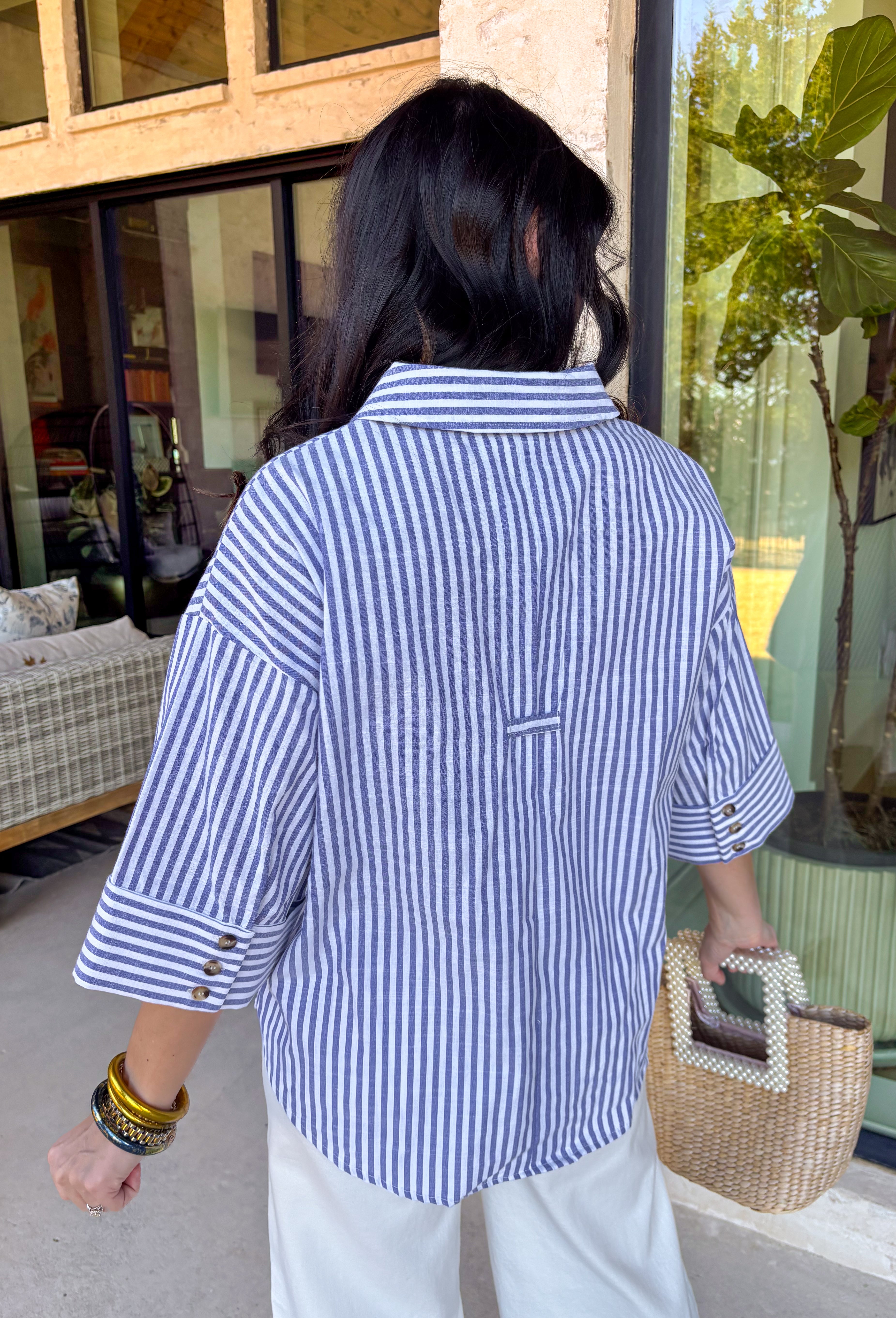 Nothing says fresh spring style like a crisp blue and white stripe! This 3/4 sleeve top is the perfect mix of classic and effortless, featuring a flattering v-neckline with a polished collared finish that instantly elevates your look. The cuffed sleeves with button details add a tailored touch, making it easy to dress up for work or keep casual for weekend plans. Lightweight, comfy, and endlessly wearable—this is the kind of top you’ll keep reaching for all season long.