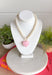 Sweet, playful, and full of charm! This white beaded necklace features a light pink heart pendant that adds the perfect soft pop of color. The combination of crisp white beads and the blush heart charm creates a fresh, feminine look that’s easy to style for everyday wear. Lightweight and easy to layer, this necklace looks just as cute worn on its own as it does stacked with your favorite gold or beaded pieces. It’s a simple way to add a little love and personality to any outfit.
