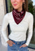 Add an easy western-inspired touch to your outfit with this burgundy bandana neck scarf. The bold burgundy color makes it a versatile accessory for fall while the soft material keeps it comfortable enough to wear all day long. Tie it around your neck for a classic bandana look, wear it as a headband, or knot it onto your favorite handbag for a fun pop of personality. From gameday and concerts to weekend plans and fall outings, there are plenty of ways to make this scarf your own.