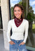 Add an easy western-inspired touch to your outfit with this burgundy bandana neck scarf. The bold burgundy color makes it a versatile accessory for fall while the soft material keeps it comfortable enough to wear all day long. Tie it around your neck for a classic bandana look, wear it as a headband, or knot it onto your favorite handbag for a fun pop of personality. From gameday and concerts to weekend plans and fall outings, there are plenty of ways to make this scarf your own.