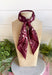 Add an easy western-inspired touch to your outfit with this burgundy bandana neck scarf. The bold burgundy color makes it a versatile accessory for fall while the soft material keeps it comfortable enough to wear all day long. Tie it around your neck for a classic bandana look, wear it as a headband, or knot it onto your favorite handbag for a fun pop of personality. From gameday and concerts to weekend plans and fall outings, there are plenty of ways to make this scarf your own.