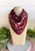 Add an easy western-inspired touch to your outfit with this burgundy bandana neck scarf. The bold burgundy color makes it a versatile accessory for fall while the soft material keeps it comfortable enough to wear all day long. Tie it around your neck for a classic bandana look, wear it as a headband, or knot it onto your favorite handbag for a fun pop of personality. From gameday and concerts to weekend plans and fall outings, there are plenty of ways to make this scarf your own.
