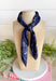 Add an easy western-inspired touch to your outfit with this navy bandana neck scarf. The rich navy color makes it a versatile accessory for fall while the soft material keeps it comfortable enough to wear all day long. Tie it around your neck for a classic bandana look, wear it as a headband, or knot it onto your favorite handbag for a fun pop of personality. From gameday and concerts to weekend plans and fall outings, there are plenty of ways to make this scarf your own.