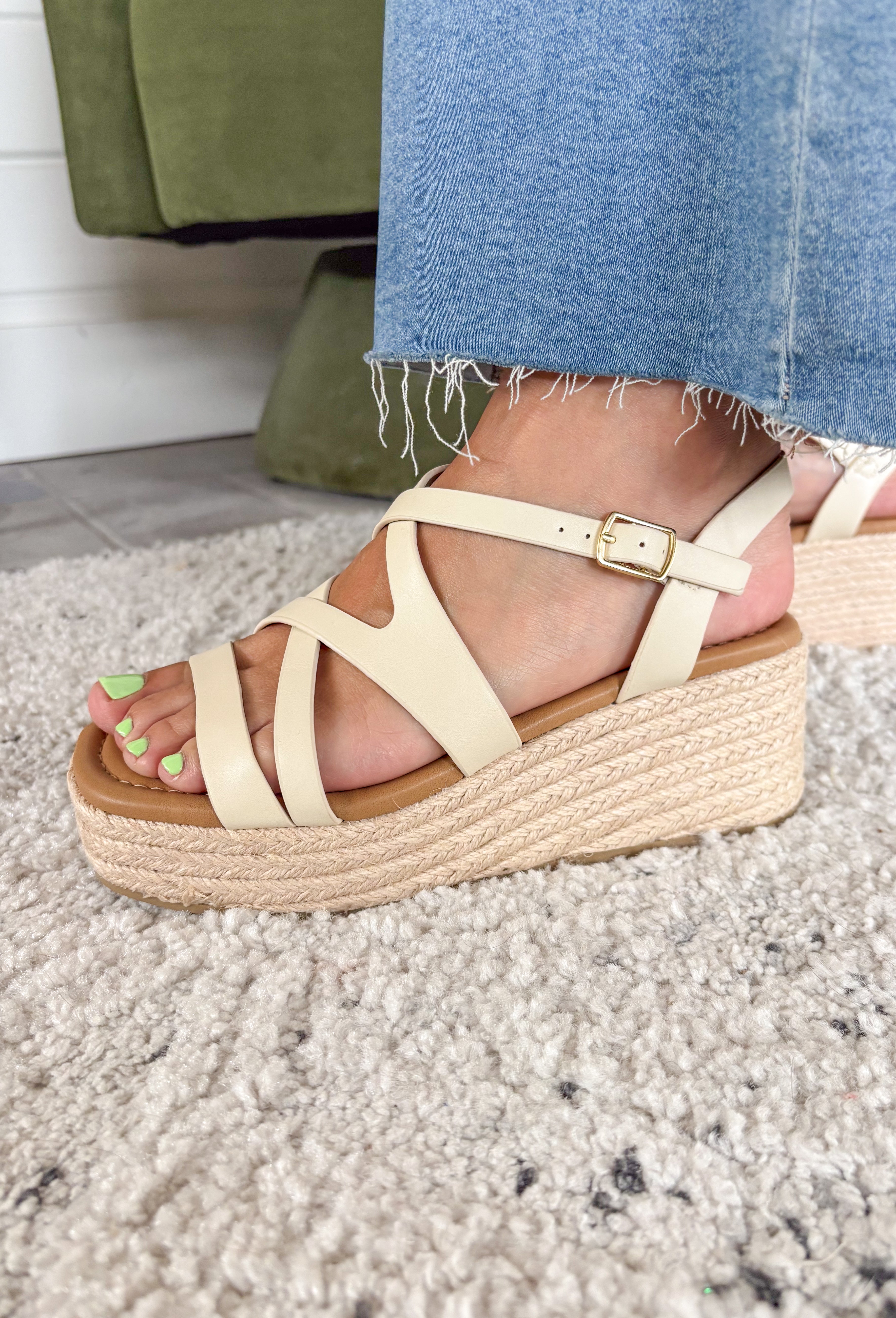 Effortless, versatile, and perfect for sunny days! These neutral wedge sandals feature soft neutral straps in a flattering criss cross design that pairs with just about everything in your closet. The woven espadrille platform adds that classic warm-weather touch, giving you a little height while still feeling easy to walk in. Finished with an adjustable ankle buckle for a secure fit, these wedges are perfect for dressing up your everyday looks or adding a polished touch to your favorite dresses.