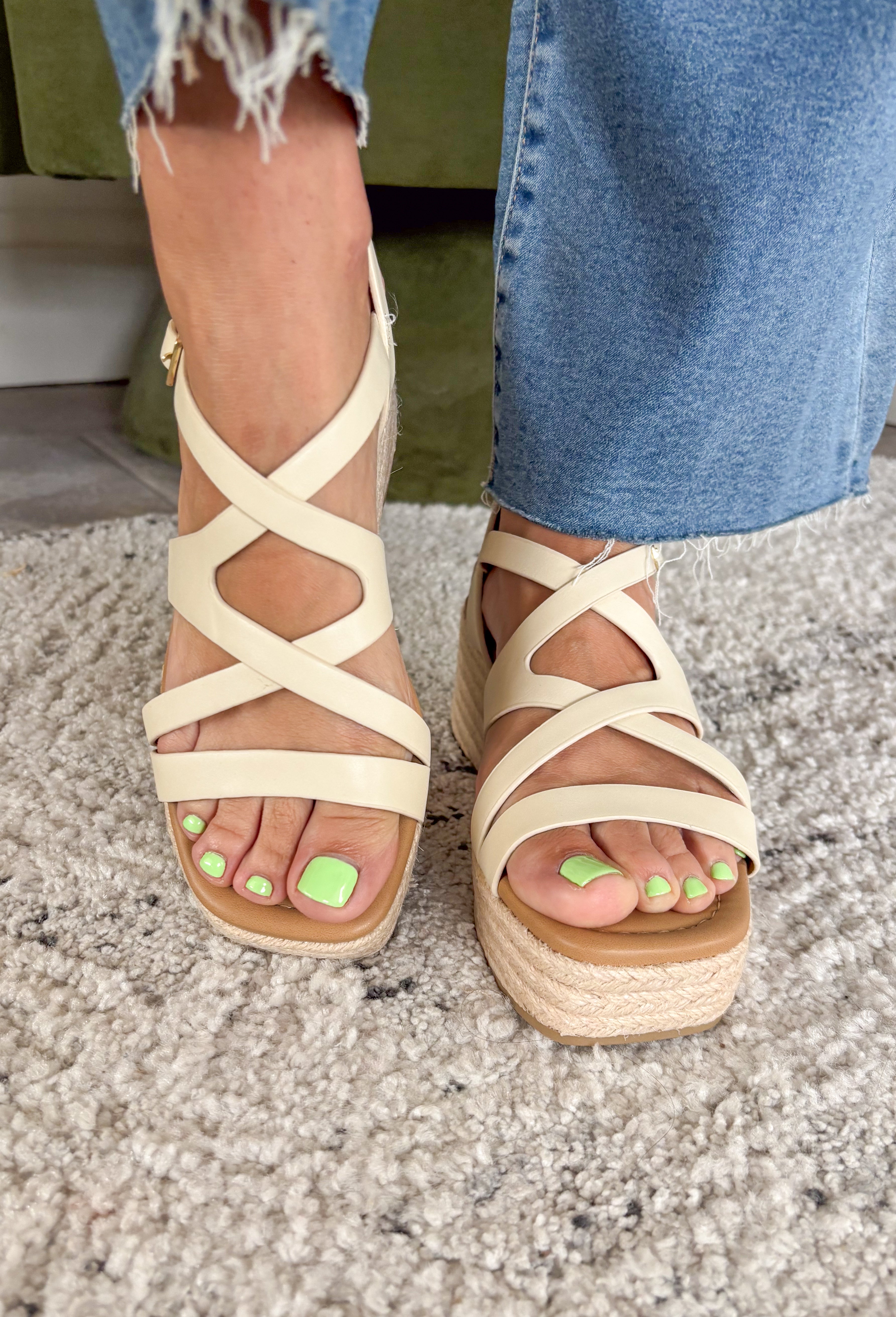 Effortless, versatile, and perfect for sunny days! These neutral wedge sandals feature soft neutral straps in a flattering criss cross design that pairs with just about everything in your closet. The woven espadrille platform adds that classic warm-weather touch, giving you a little height while still feeling easy to walk in. Finished with an adjustable ankle buckle for a secure fit, these wedges are perfect for dressing up your everyday looks or adding a polished touch to your favorite dresses.