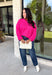 Every wardrobe needs a classic sweater you'll reach for season after season, and this cozy knit from Double Zero is just that. Designed in a bold fuchsia hue, this timeless sweater is effortlessly versatile and easy to style with all your favorite fall pieces. Ribbed detailing at the neckline, cuffs, and hem adds a polished finish, while the ultra-soft knit keeps you warm and comfortable without feeling bulky. 