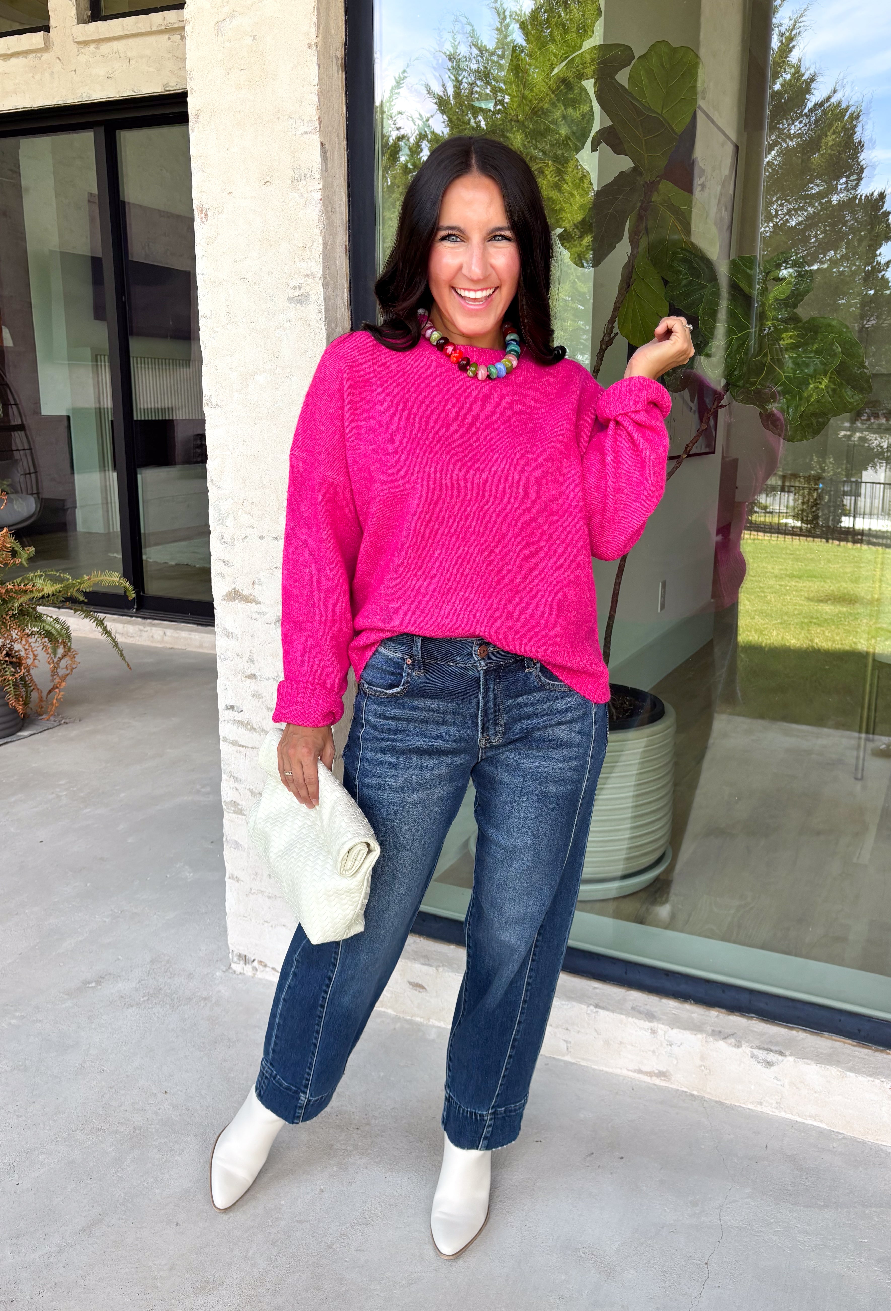 Every wardrobe needs a classic sweater you'll reach for season after season, and this cozy knit from Double Zero is just that. Designed in a bold fuchsia hue, this timeless sweater is effortlessly versatile and easy to style with all your favorite fall pieces. Ribbed detailing at the neckline, cuffs, and hem adds a polished finish, while the ultra-soft knit keeps you warm and comfortable without feeling bulky. 