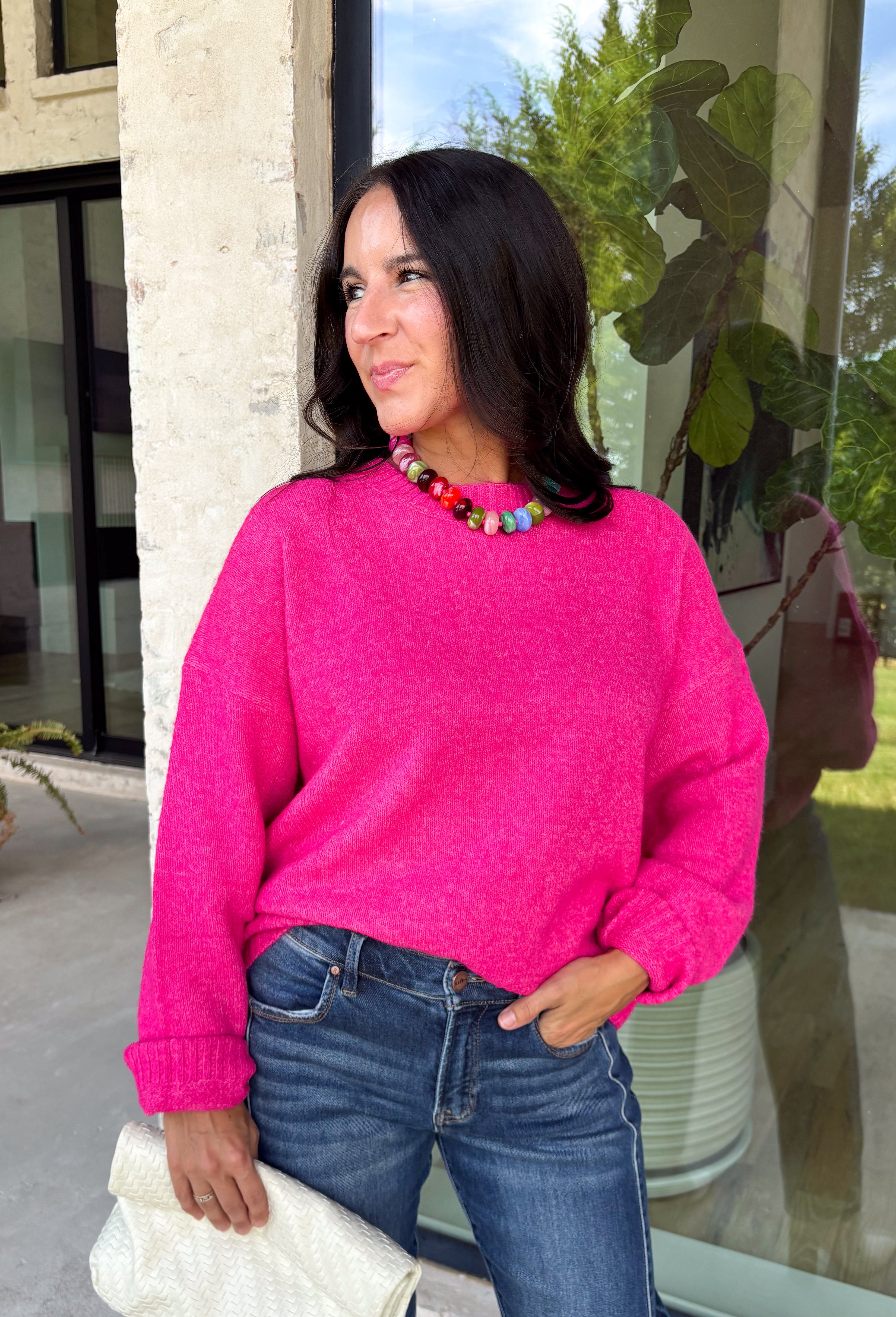 Every wardrobe needs a classic sweater you'll reach for season after season, and this cozy knit from Double Zero is just that. Designed in a bold fuchsia hue, this timeless sweater is effortlessly versatile and easy to style with all your favorite fall pieces. Ribbed detailing at the neckline, cuffs, and hem adds a polished finish, while the ultra-soft knit keeps you warm and comfortable without feeling bulky. 