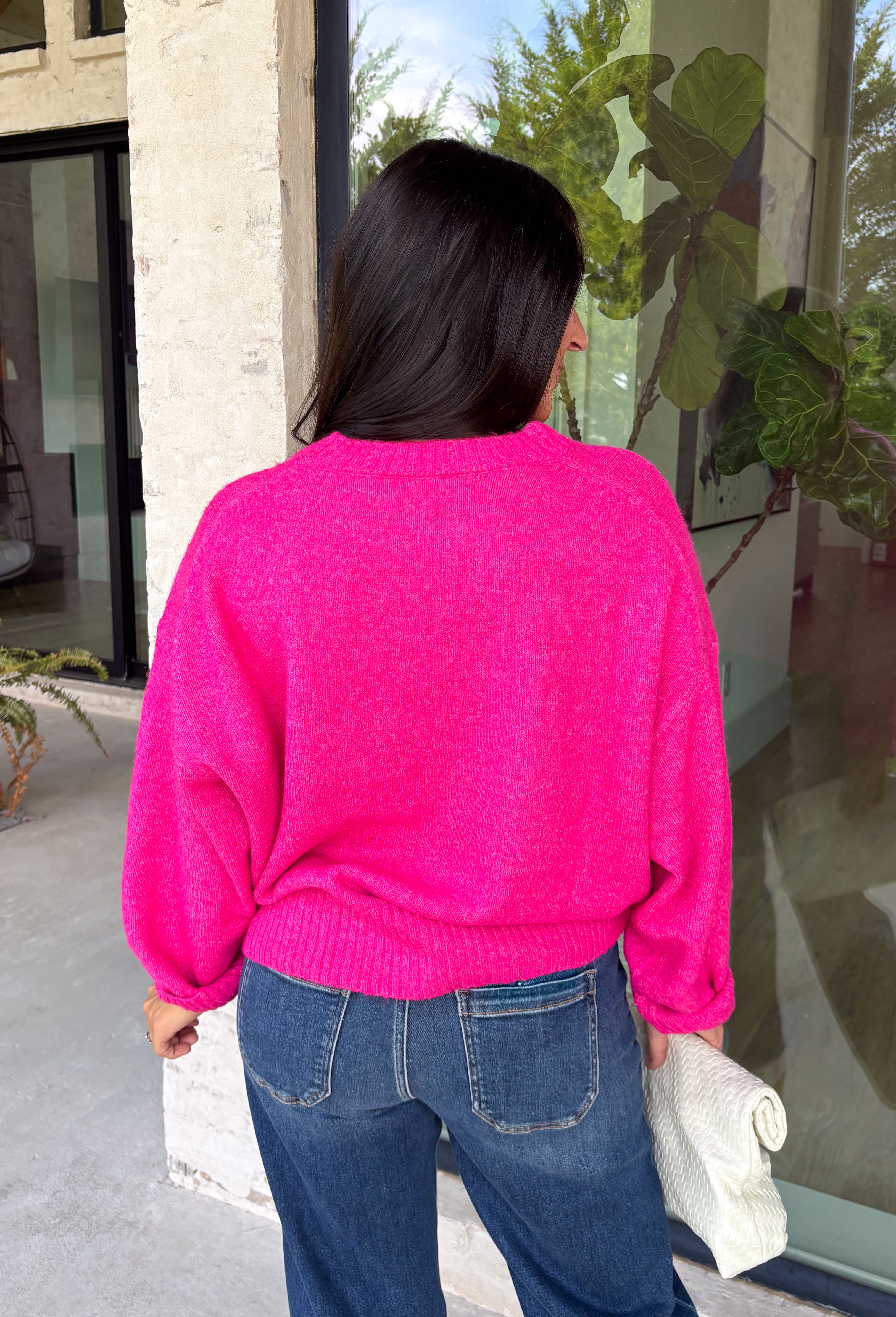 Every wardrobe needs a classic sweater you'll reach for season after season, and this cozy knit from Double Zero is just that. Designed in a bold fuchsia hue, this timeless sweater is effortlessly versatile and easy to style with all your favorite fall pieces. Ribbed detailing at the neckline, cuffs, and hem adds a polished finish, while the ultra-soft knit keeps you warm and comfortable without feeling bulky. 