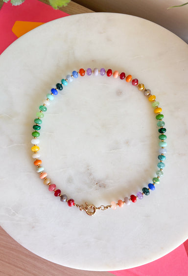 Add a fun pop of color to every outfit with this trendy beaded necklace! Featuring a vibrant mix of colorful beads, this playful accessory is perfect for brightening up everything from casual tees to cozy sweaters. The gold toggle clasp adds a modern, elevated finish, making it just as stylish worn on its own as it is layered with your favorite chains. It's the perfect statement piece for every season.