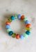 Add a playful pop of color to your everyday stack with this beaded bracelet from Garden Party. Shades of blue, orange, and green create a bright mix, while small gold beads in between add just the right touch of shine. The pull-on design makes it easy to slip on and go, whether you’re wearing it solo or mixing it with your favorite bracelets. It’s a fun little accessory for bringing extra color and personality to even the simplest outfit.