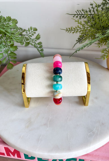 Add a playful pop of color to your everyday stack with this beaded bracelet from Garden Party. A cheerful mix of pink, burgundy, orange, blue, and green beads creates a colorful statement, while small gold beads in between each add just the right amount of shine. The pull-on design makes it easy to slip on and go, whether you wear it by itself or mix it into your favorite bracelet stack. It’s an easy way to bring a little extra color and personality to everything from cozy sweaters to everyday denim.
