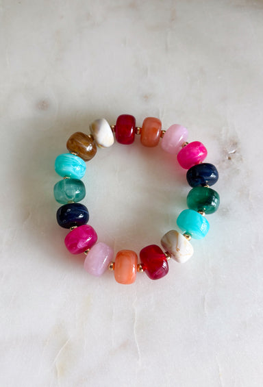 Add a playful pop of color to your everyday stack with this beaded bracelet from Garden Party. A cheerful mix of pink, burgundy, orange, blue, and green beads creates a colorful statement, while small gold beads in between each add just the right amount of shine. The pull-on design makes it easy to slip on and go, whether you wear it by itself or mix it into your favorite bracelet stack. It’s an easy way to bring a little extra color and personality to everything from cozy sweaters to everyday denim.
