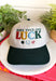 A little luck and a lot of style! This trucker hat features beautifully embroidered "Make Your Own Luck" lettering alongside a four-leaf clover, horseshoe, and ladybug in rich, eye-catching colors. The neutral crown paired with the dark green bill gives it a timeless look that's easy to style, while the detailed embroidery adds the perfect touch of personality. 