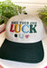 A little luck and a lot of style! This trucker hat features beautifully embroidered "Make Your Own Luck" lettering alongside a four-leaf clover, horseshoe, and ladybug in rich, eye-catching colors. The neutral crown paired with the dark green bill gives it a timeless look that's easy to style, while the detailed embroidery adds the perfect touch of personality. 