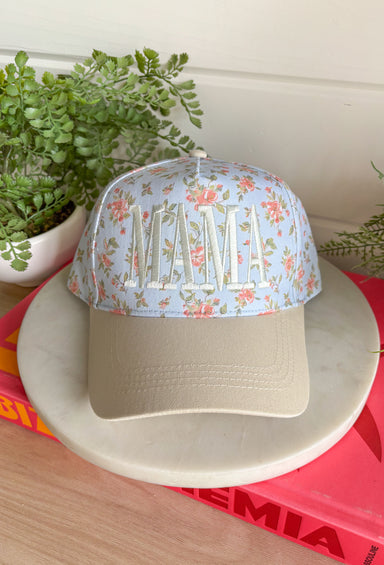 This light blue “Mama” trucker hat is the sweetest little add-on for your summer days! Featuring a dainty floral print and soft neutral embroidery, it has that perfect mix of feminine and casual. The neutral bill keeps it easy to style with all your everyday outfits, while the adjustable fit make it ideal for busy days on the go. Whether you're heading to the ball field, running errands, or enjoying a sunny afternoon, this hat adds a cute, effortless touch. 