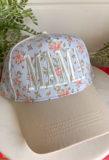 This light blue “Mama” trucker hat is the sweetest little add-on for your summer days! Featuring a dainty floral print and soft neutral embroidery, it has that perfect mix of feminine and casual. The neutral bill keeps it easy to style with all your everyday outfits, while the adjustable fit make it ideal for busy days on the go. Whether you're heading to the ball field, running errands, or enjoying a sunny afternoon, this hat adds a cute, effortless touch. 