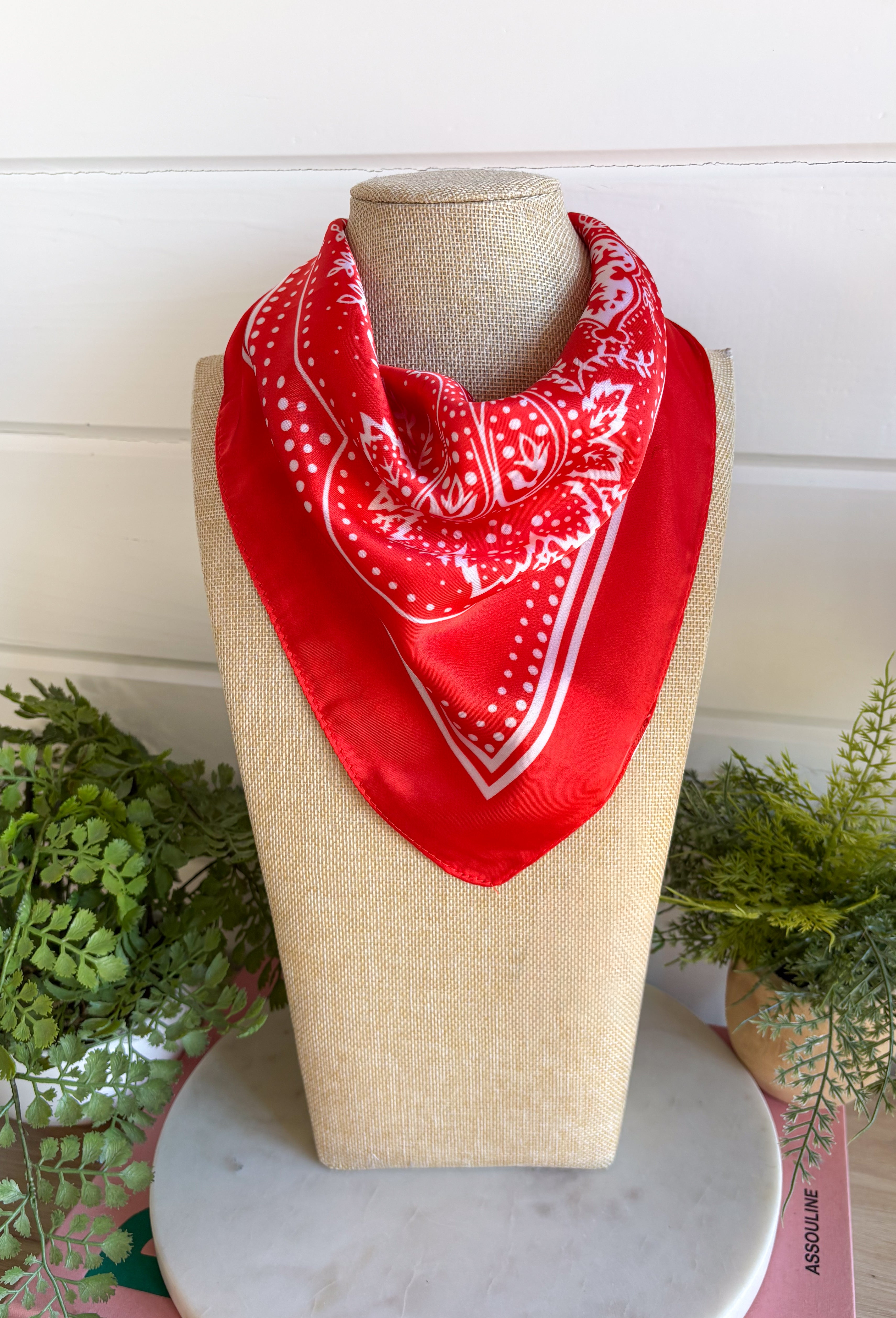 Add an easy western-inspired touch to your outfit with this red bandana neck scarf. The bold red color makes it a versatile accessory for fall while the soft material keeps it comfortable enough to wear all day long. Tie it around your neck for a classic bandana look, wear it as a headband, or knot it onto your favorite handbag for a fun pop of personality. From gameday and concerts to weekend plans and fall outings, there are plenty of ways to make this scarf your own.