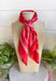 Add an easy western-inspired touch to your outfit with this red bandana neck scarf. The bold red color makes it a versatile accessory for fall while the soft material keeps it comfortable enough to wear all day long. Tie it around your neck for a classic bandana look, wear it as a headband, or knot it onto your favorite handbag for a fun pop of personality. From gameday and concerts to weekend plans and fall outings, there are plenty of ways to make this scarf your own.