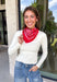 Add an easy western-inspired touch to your outfit with this red bandana neck scarf. The bold red color makes it a versatile accessory for fall while the soft material keeps it comfortable enough to wear all day long. Tie it around your neck for a classic bandana look, wear it as a headband, or knot it onto your favorite handbag for a fun pop of personality. From gameday and concerts to weekend plans and fall outings, there are plenty of ways to make this scarf your own.
