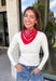 Add an easy western-inspired touch to your outfit with this red bandana neck scarf. The bold red color makes it a versatile accessory for fall while the soft material keeps it comfortable enough to wear all day long. Tie it around your neck for a classic bandana look, wear it as a headband, or knot it onto your favorite handbag for a fun pop of personality. From gameday and concerts to weekend plans and fall outings, there are plenty of ways to make this scarf your own.
