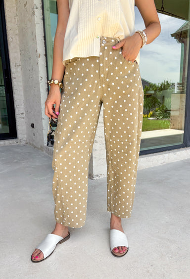Step into fall with denim that's anything but ordinary! These tan barrel jeans feature a charming white polka dot print that adds the perfect touch of personality while staying easy to style. The on-trend barrel leg silhouette gives them a modern, fashion-forward feel, and the warm neutral color makes them a versatile addition to your autumn wardrobe. Whether you're pairing them with a cozy sweater, a fitted knit, or your favorite blouse, these jeans are guaranteed to make a statement. 