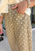 Step into fall with denim that's anything but ordinary! These tan barrel jeans feature a charming white polka dot print that adds the perfect touch of personality while staying easy to style. The on-trend barrel leg silhouette gives them a modern, fashion-forward feel, and the warm neutral color makes them a versatile addition to your autumn wardrobe. Whether you're pairing them with a cozy sweater, a fitted knit, or your favorite blouse, these jeans are guaranteed to make a statement. 
