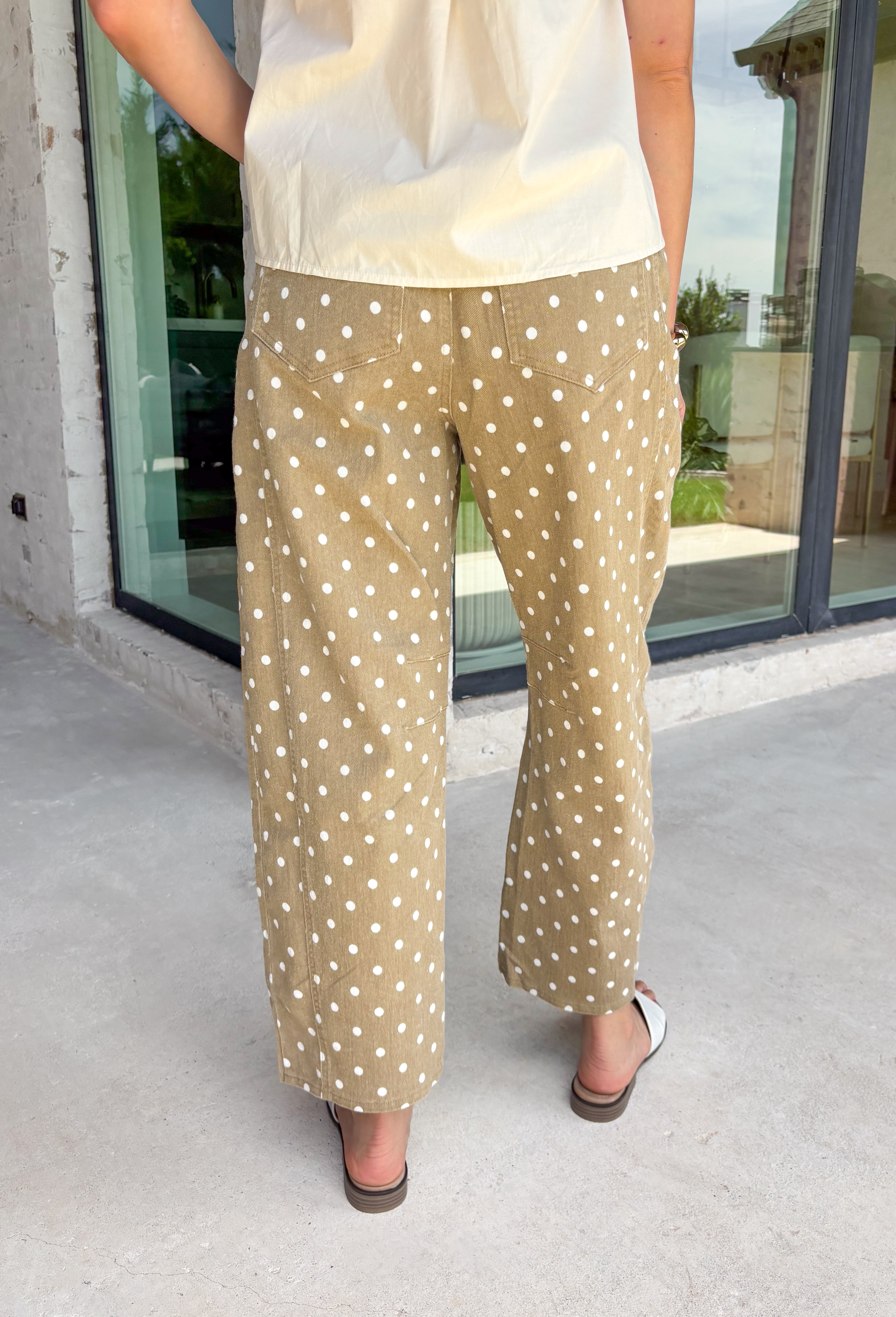 Step into fall with denim that's anything but ordinary! These tan barrel jeans feature a charming white polka dot print that adds the perfect touch of personality while staying easy to style. The on-trend barrel leg silhouette gives them a modern, fashion-forward feel, and the warm neutral color makes them a versatile addition to your autumn wardrobe. Whether you're pairing them with a cozy sweater, a fitted knit, or your favorite blouse, these jeans are guaranteed to make a statement. 