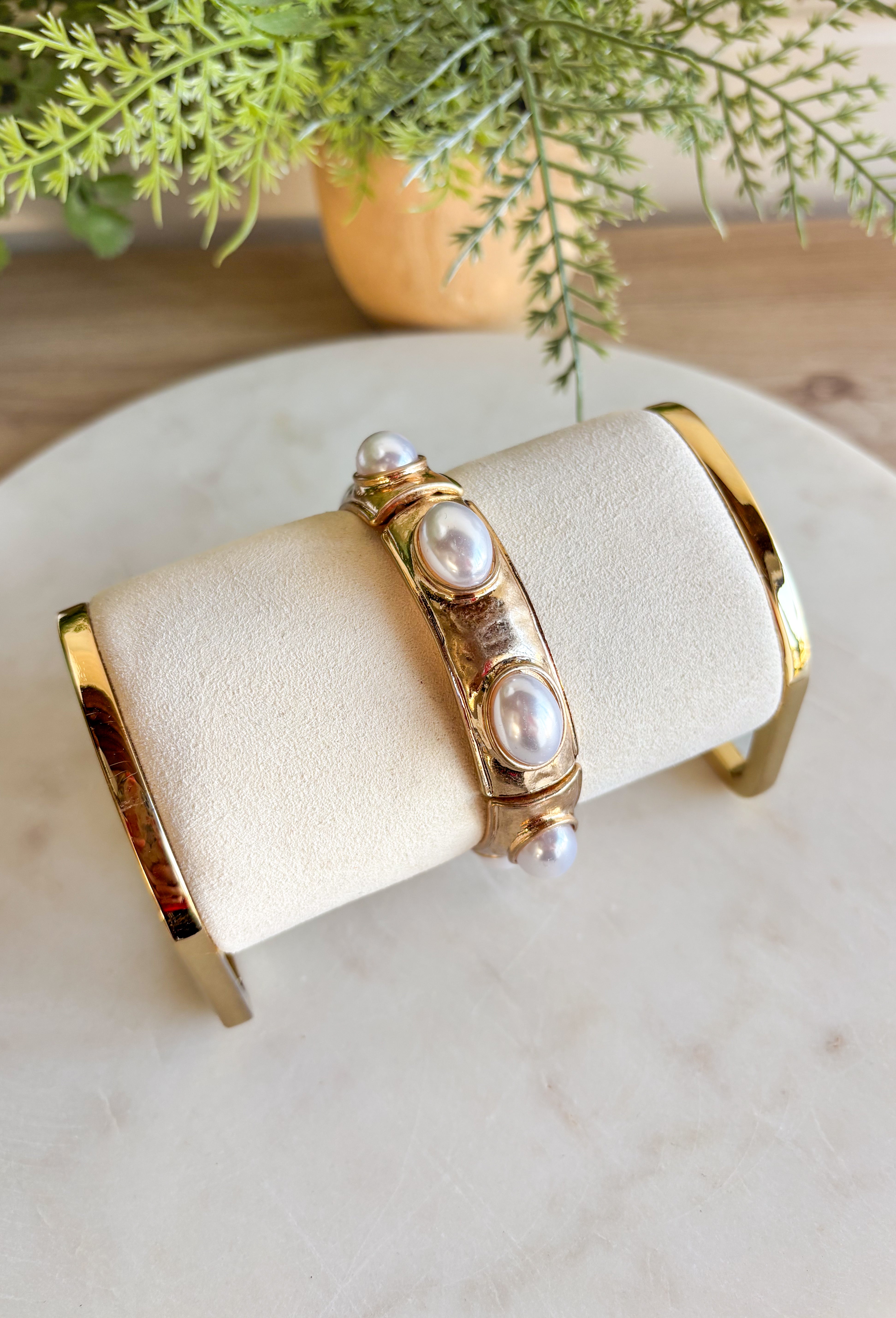 Add a touch of color and shine to your look with this gold bracelet featuring pearls all around. Designed in a pull-on style for easy wear, it’s lightweight, versatile, and the perfect finishing piece for both casual and dressier outfits. With its timeless mix of gold and pearls, this bracelet is one you’ll reach for season after season.