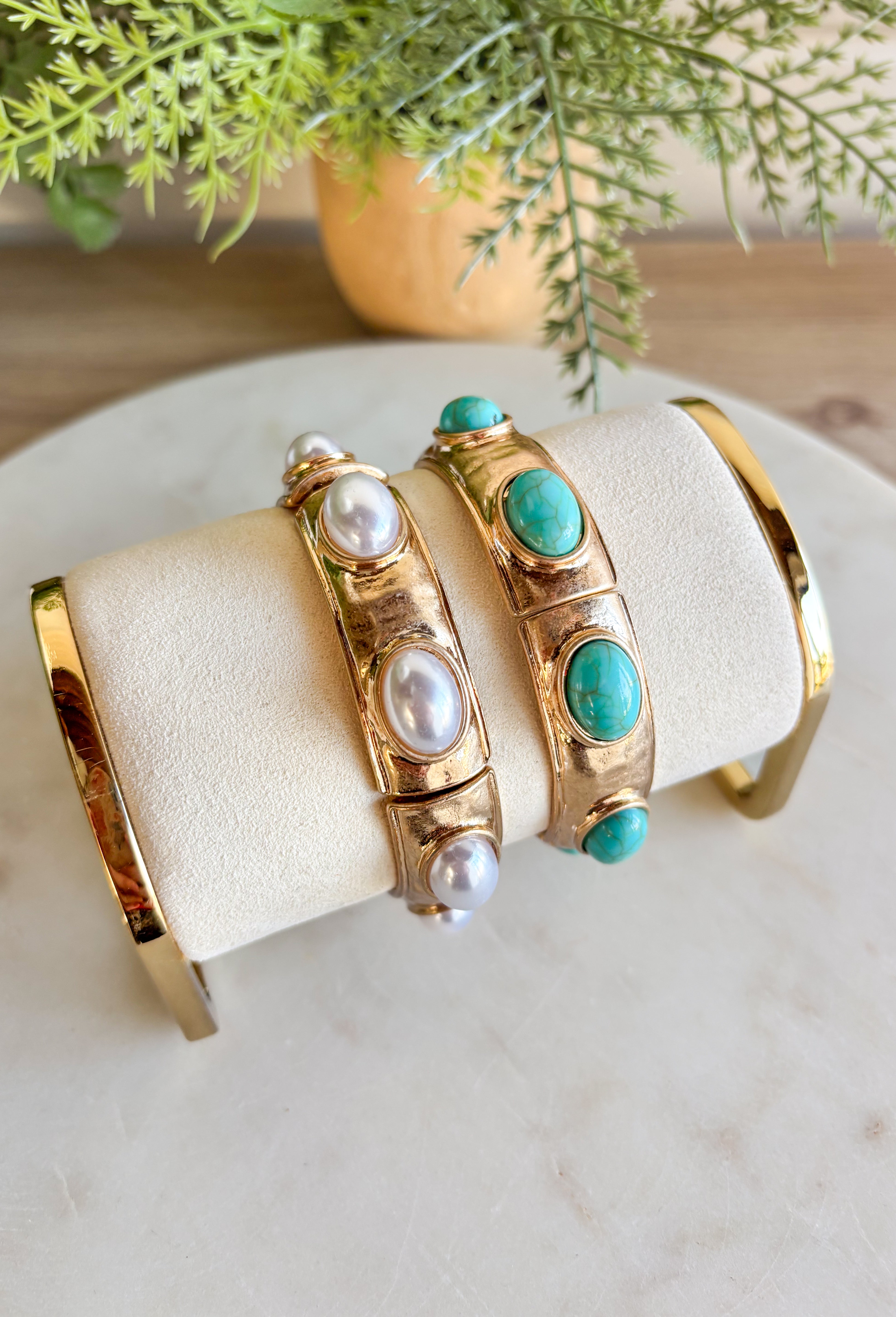 Add a touch of color and shine to your look with this gold bracelet featuring turquoise stones all around. Designed in a pull-on style for easy wear, it’s lightweight, versatile, and the perfect finishing piece for both casual and dressier outfits. With its timeless mix of gold and turquoise, this bracelet is one you’ll reach for season after season.