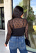 Meet the layering piece that adds a pretty touch to all your cooler-weather outfits. This black lace top from Hyfve features an allover lace design and mock neckline, giving even the simplest sweater, vest, or dress a little extra texture. The long sleeves are perfect for peeking out from underneath your favorite layers as the weather shifts from late fall into winter. A touch of spandex gives the fabric comfortable stretch, making it easy to wear underneath other pieces without adding bulky layers. 