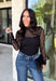 Meet the layering piece that adds a pretty touch to all your cooler-weather outfits. This black lace top from Hyfve features an allover lace design and mock neckline, giving even the simplest sweater, vest, or dress a little extra texture. The long sleeves are perfect for peeking out from underneath your favorite layers as the weather shifts from late fall into winter. A touch of spandex gives the fabric comfortable stretch, making it easy to wear underneath other pieces without adding bulky layers. 