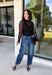 Meet the layering piece that adds a pretty touch to all your cooler-weather outfits. This black lace top from Hyfve features an allover lace design and mock neckline, giving even the simplest sweater, vest, or dress a little extra texture. The long sleeves are perfect for peeking out from underneath your favorite layers as the weather shifts from late fall into winter. A touch of spandex gives the fabric comfortable stretch, making it easy to wear underneath other pieces without adding bulky layers. 