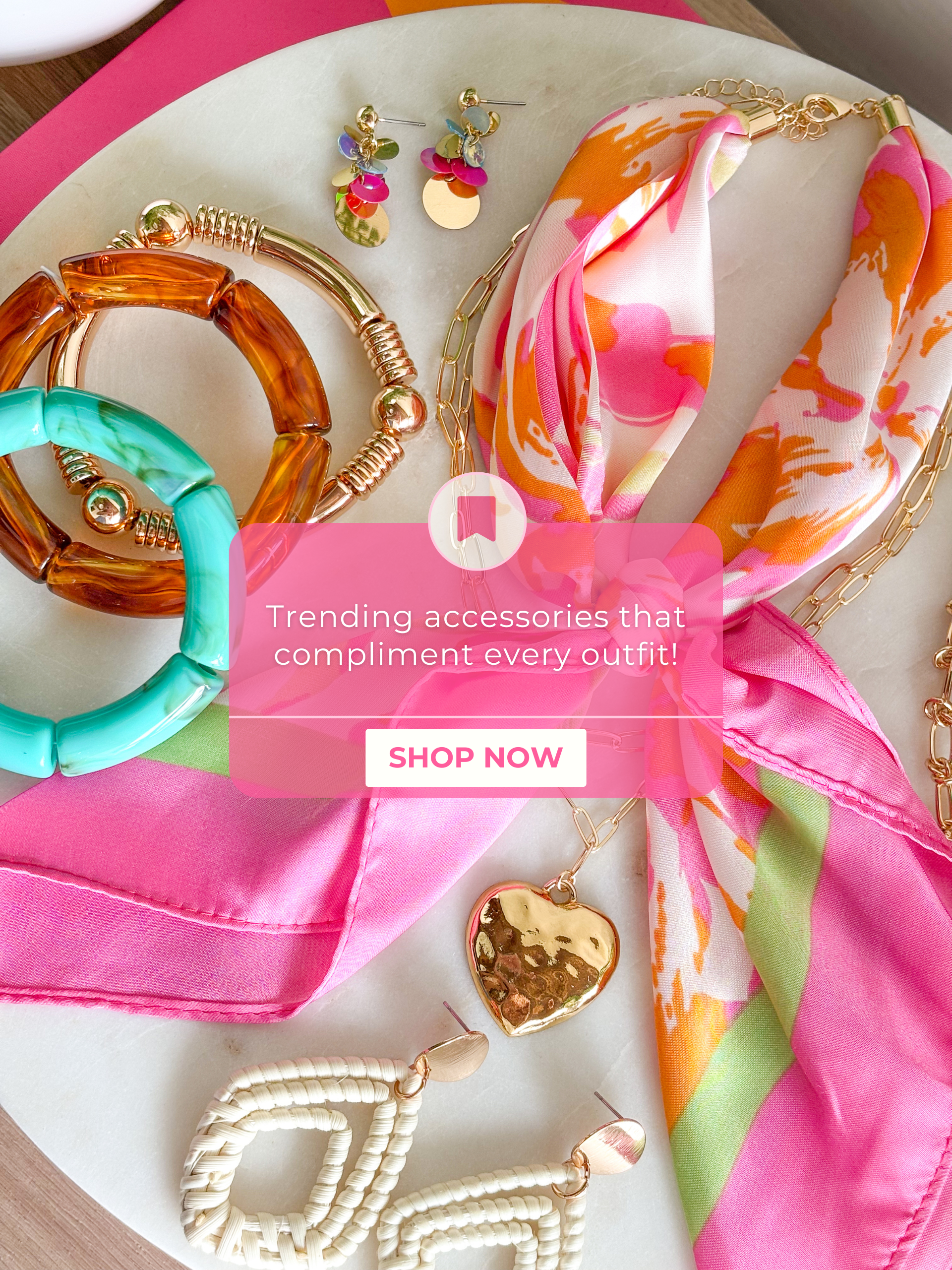 Trending accessories that compliment every outfit! Shop now!

multiple colorful jewelry pieces layered in the back on a marble tile 