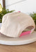 This neutral trucker hat is a sweet, feel-good accessory with a fun pop of color. Designed with a soft light pink bill and “Mother” embroidered across the front in a colorful print, it’s playful, meaningful, and easy to wear. The neutral base keeps it versatile, while the adjustable back ensures a comfortable, customizable fit. Perfect for everyday errands, casual outings, or gifting to a mama who deserves a little extra love.