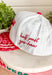 Bring a little western charm and plenty of personality to your everyday style with this fun trucker hat. Featuring a neutral front paired with a bold red bandana print bill, this standout accessory is embroidered with "Not Gonna Hold My Horses" across the front in vibrant red stitching. The side is finished with "Half Past Yee-Haw" embroidery, while a red embroidered horseshoe on the back adds the perfect finishing touch. 