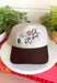 This trucker hat brings the perfect mix of western charm and playful personality! Featuring an embroidered cowboy, cactus, and the phrase "Oh Shoot," it's a fun conversation starter that adds a little humor to any casual outfit. The neutral crown and brown bill make it easy to pair with just about everything, while the adjustable fit keeps it comfortable for all-day wear. 