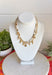 This layered necklace gives you that perfectly styled, on-trend look without any effort! Featuring a neutral beaded strand with gold accents paired with a charm-filled gold chain, it brings the perfect mix of western-inspired and playful details. With charms like a cross, heart, palm leaf, bow, and even a shoe, it adds so much personality to your outfit. Lightweight and easy to wear, it’s the ultimate throw-on accessory for summer days when you want to look put together in seconds. 