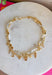 This layered necklace gives you that perfectly styled, on-trend look without any effort! Featuring a neutral beaded strand with gold accents paired with a charm-filled gold chain, it brings the perfect mix of western-inspired and playful details. With charms like a cross, heart, palm leaf, bow, and even a shoe, it adds so much personality to your outfit. Lightweight and easy to wear, it’s the ultimate throw-on accessory for summer days when you want to look put together in seconds. 